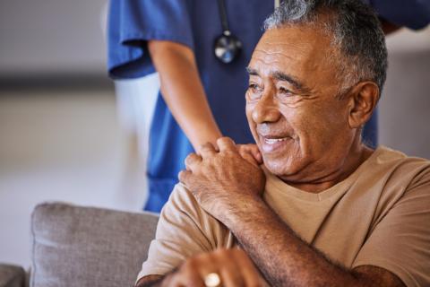 Professional caregiver and elderly gentleman