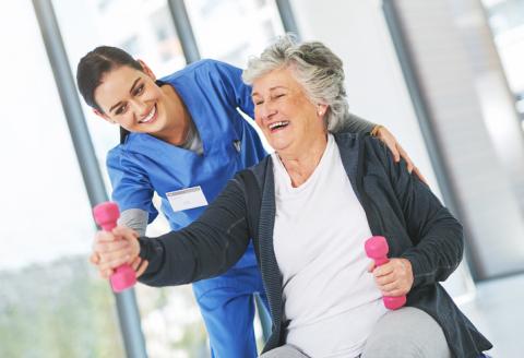 Elderly woman receiving physical rehab